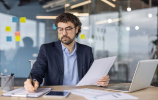 Local service business owner reviewing leads from online advertising