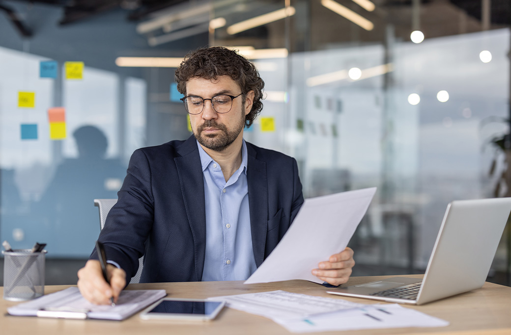 Local service business owner reviewing leads from online advertising